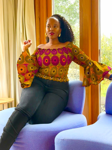 African print bell sleeves Smocked top in a vintage geometric print.