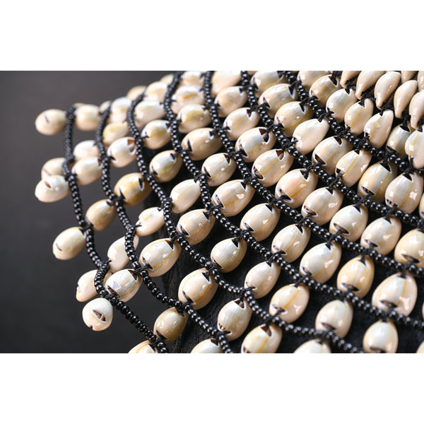 Statement Cowrie bib necklace.
