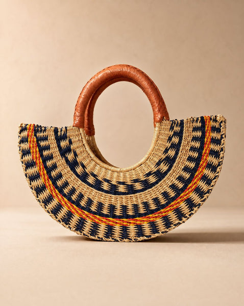 Hand woven sculptured straw half moon bag with leather handles