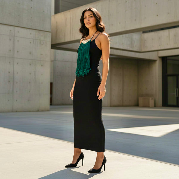 Green fringe necklace with cowrie beads.