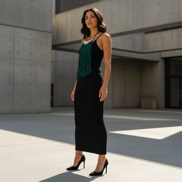 Green fringe necklace with cowrie beads.