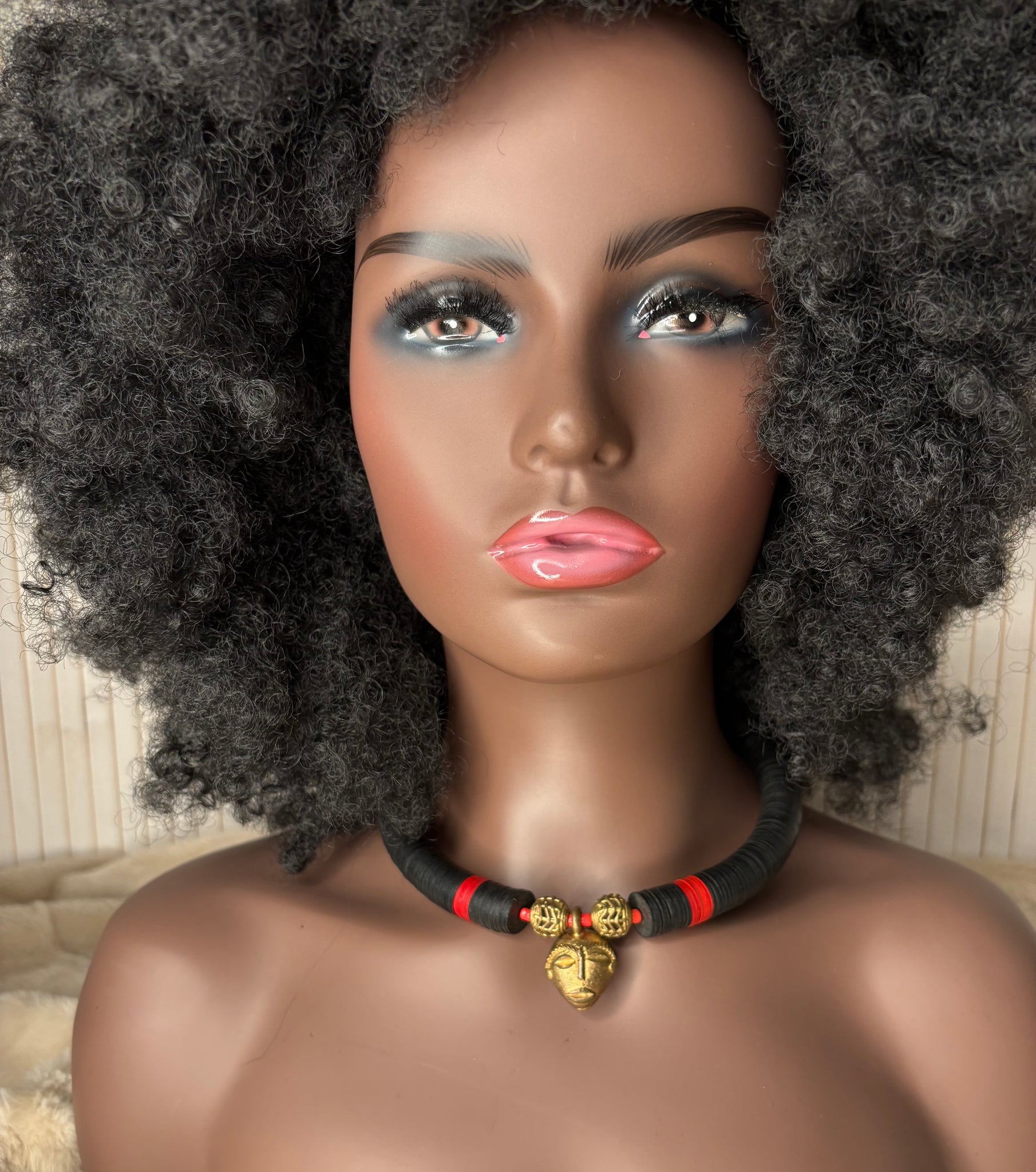 Yuya black choker with an African bronze mask pendant.