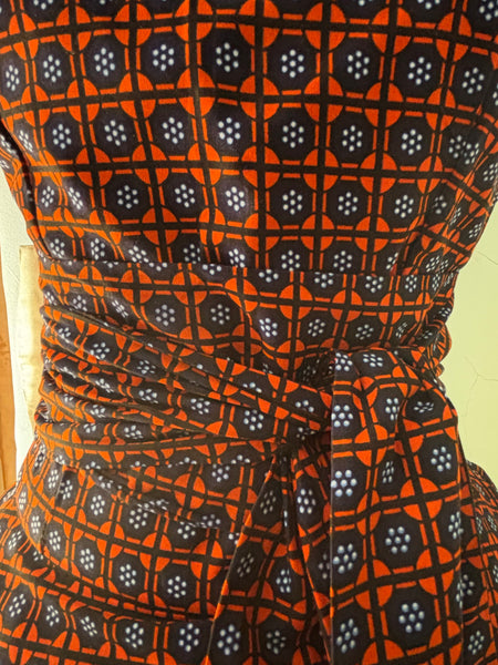 Zena Handkerchief hem peplum top in a vibrant contemporary geometric African print.