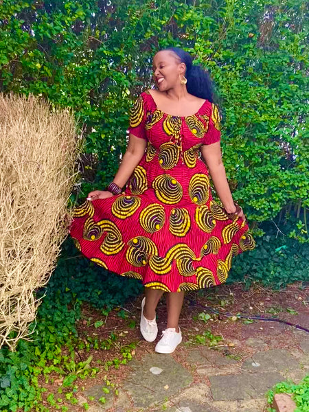 Smocked peasant inspired African print dress.