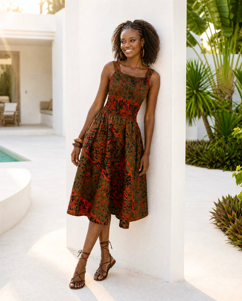 Yiko cut out dress in red and brown hues.