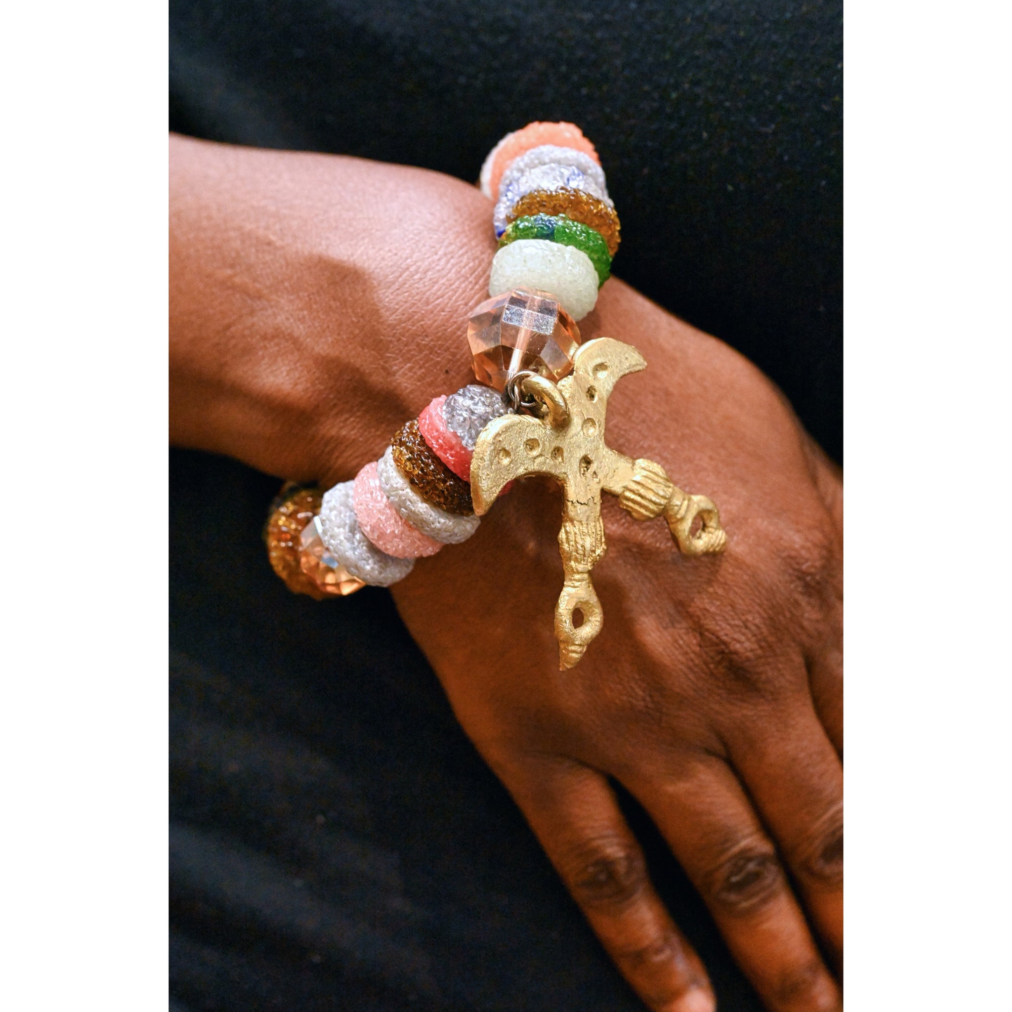 Recycled glass beads with adinkra pendant.