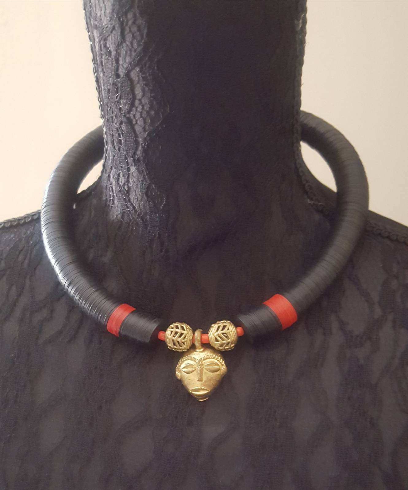 African beaded necklace with bronze African mask pendant