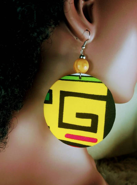 Large African print disc earrings in a yellow aztec print